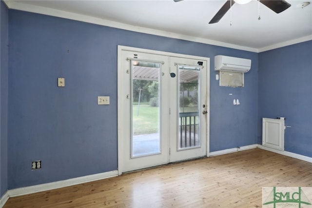 doorway to outside featuring crown molding, wood-type flooring, ceiling fan, french doors, and a wall mounted AC