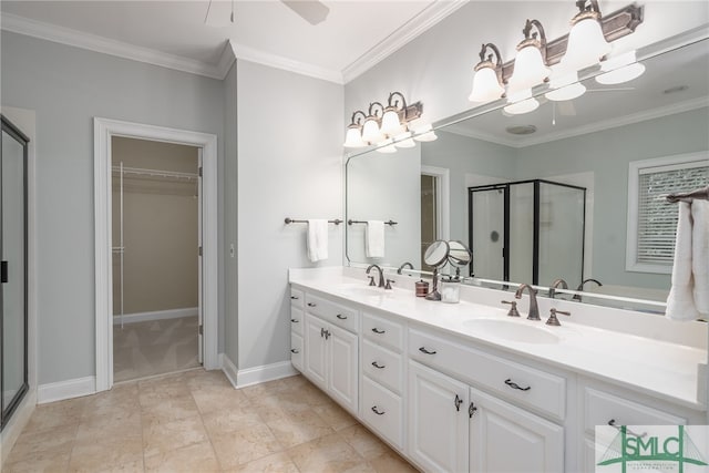 bathroom with vanity, ceiling fan, ornamental molding, and a shower with door