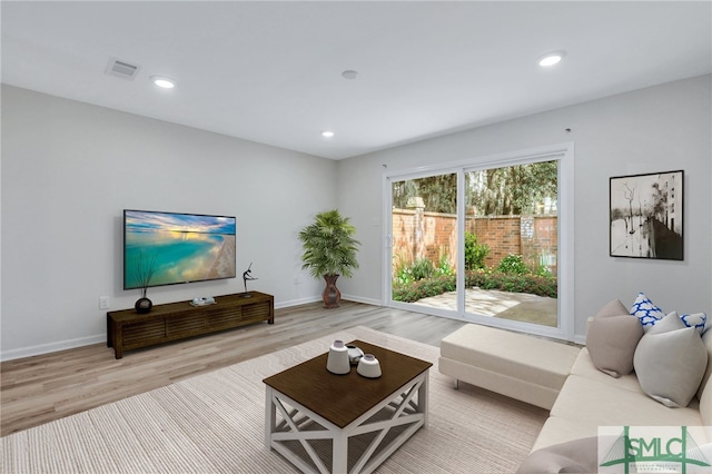 living room with light hardwood / wood-style floors