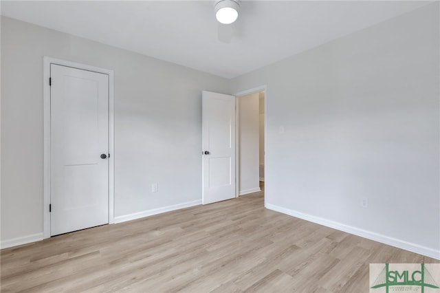 spare room with ceiling fan and light hardwood / wood-style flooring