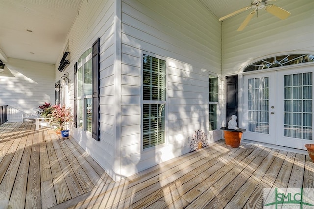 wooden deck featuring ceiling fan and covered porch