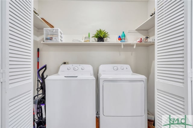 washroom featuring independent washer and dryer