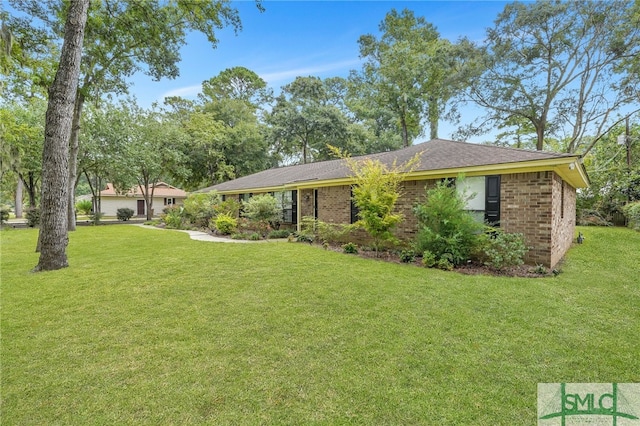 ranch-style home featuring a front yard