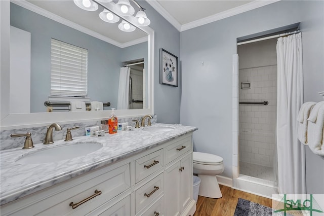 bathroom with wood-type flooring, walk in shower, crown molding, vanity, and toilet