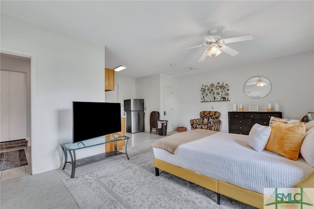 interior space with ceiling fan and stainless steel fridge