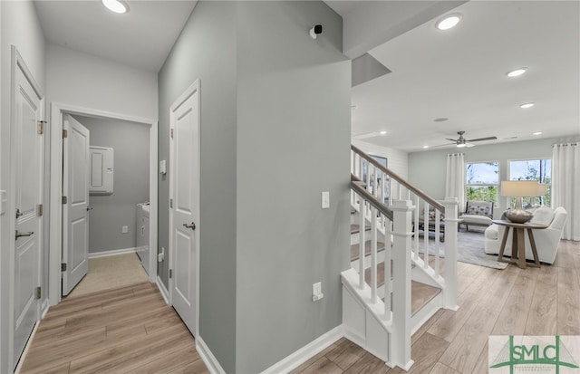 corridor featuring washer and clothes dryer and light hardwood / wood-style floors