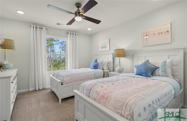 bedroom featuring light carpet and ceiling fan