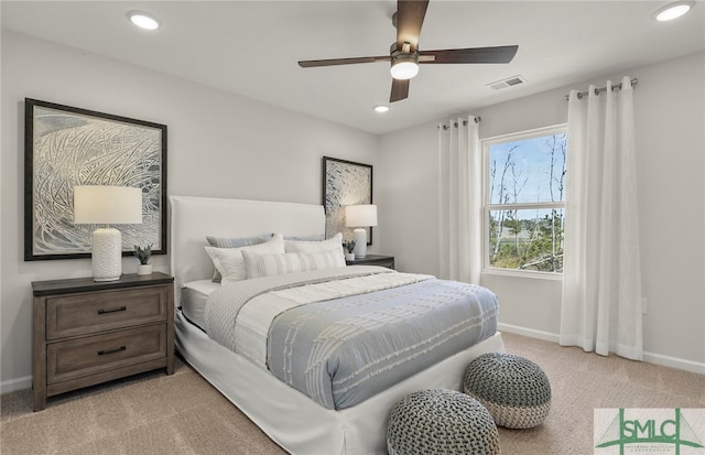 bedroom with ceiling fan and light colored carpet