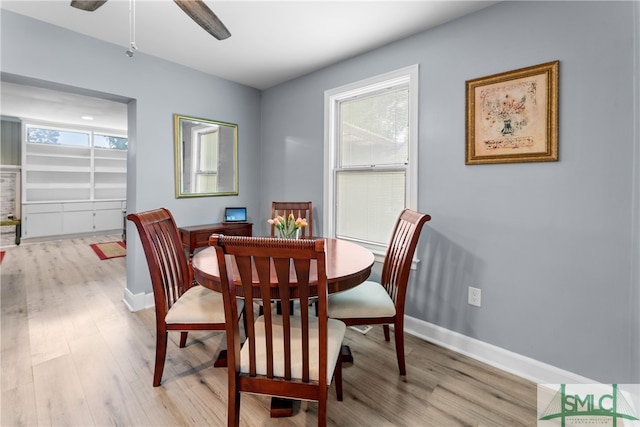 dining area featuring ceiling fan and light hardwood / wood-style flooring