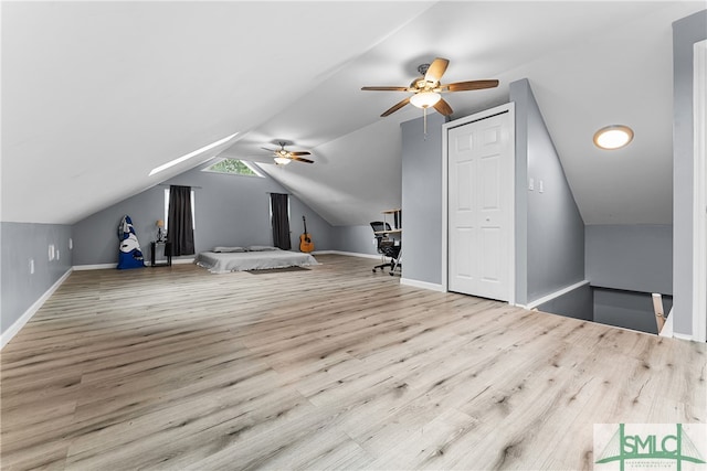 bonus room with ceiling fan, light hardwood / wood-style flooring, and lofted ceiling