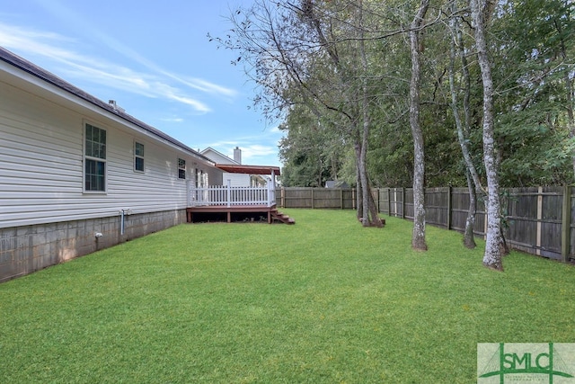 view of yard with a wooden deck