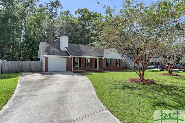 view of front of home with a garage and a front yard