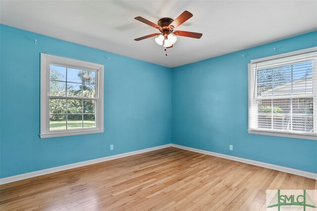 unfurnished room featuring light wood-type flooring and ceiling fan