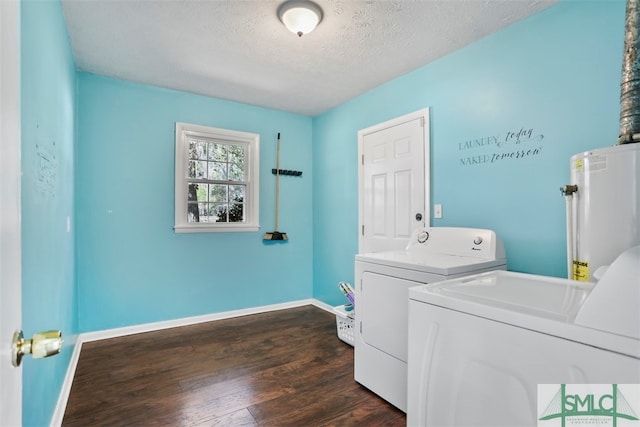 washroom with gas water heater, independent washer and dryer, dark hardwood / wood-style floors, and a textured ceiling