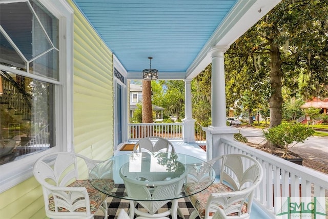 wooden terrace featuring a porch