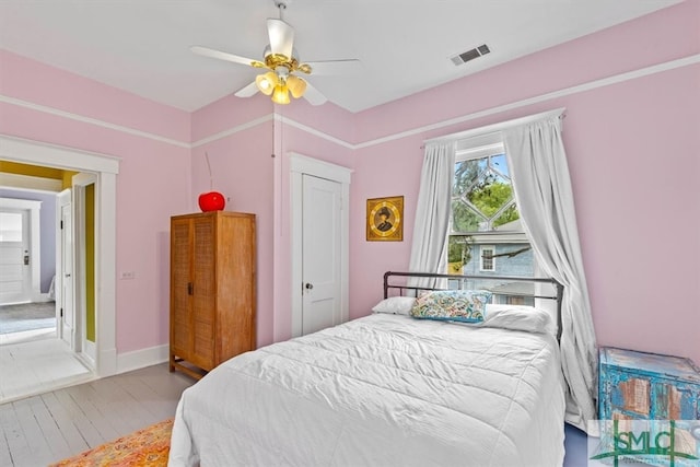 bedroom featuring a closet, ceiling fan, and hardwood / wood-style flooring