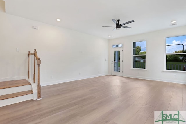 empty room featuring light wood-type flooring and ceiling fan