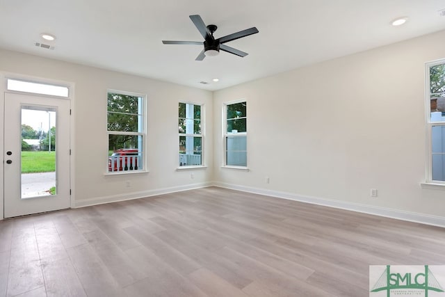 empty room featuring light hardwood / wood-style floors and ceiling fan