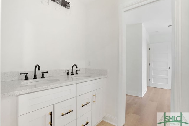 bathroom featuring vanity and hardwood / wood-style floors