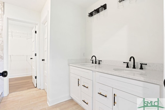 bathroom featuring vanity and hardwood / wood-style floors