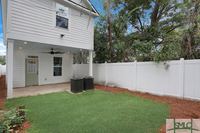 view of yard featuring central air condition unit, a patio area, and ceiling fan