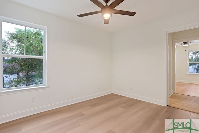 spare room featuring ceiling fan and light hardwood / wood-style flooring