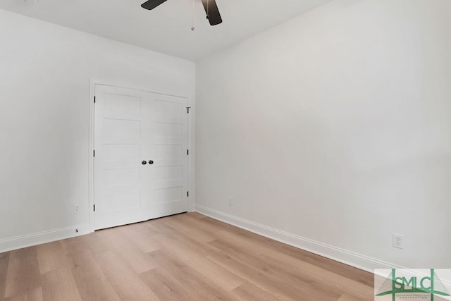 unfurnished bedroom with ceiling fan, a closet, and light hardwood / wood-style floors