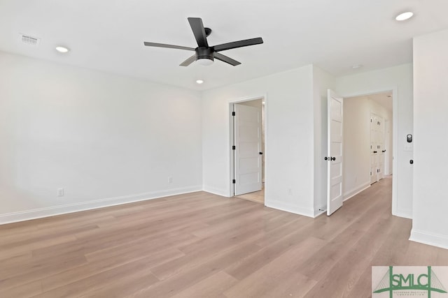 spare room with light hardwood / wood-style flooring and ceiling fan