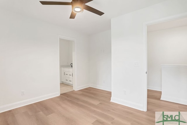 spare room featuring ceiling fan and light hardwood / wood-style flooring