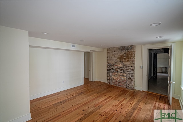 unfurnished living room featuring light hardwood / wood-style floors