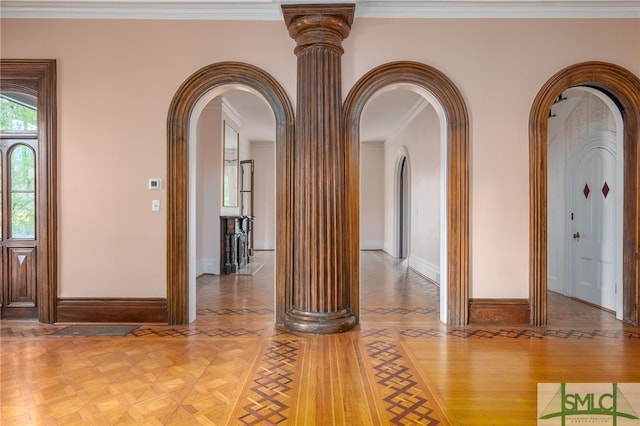 interior space with ornamental molding, parquet floors, and ornate columns