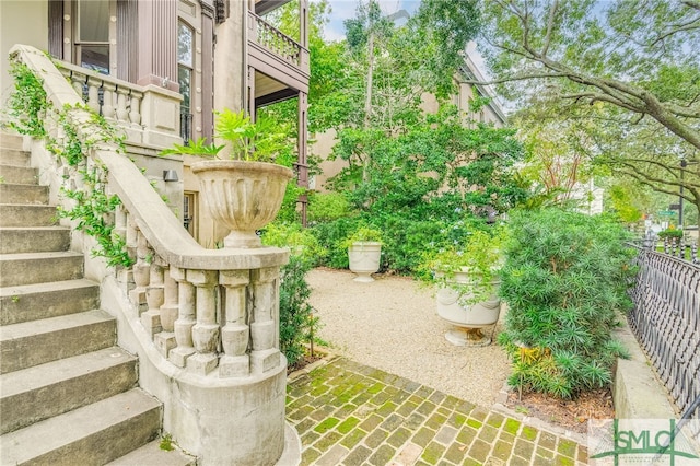 view of yard with a balcony