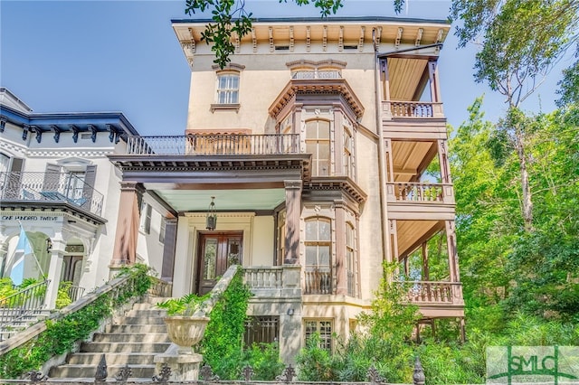 view of front of home with a balcony