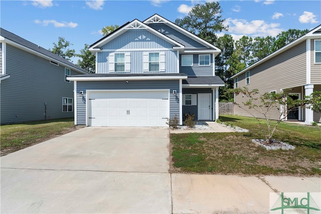 view of front of house with a garage and a front yard