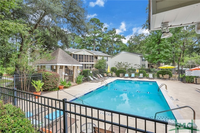 view of swimming pool featuring a patio