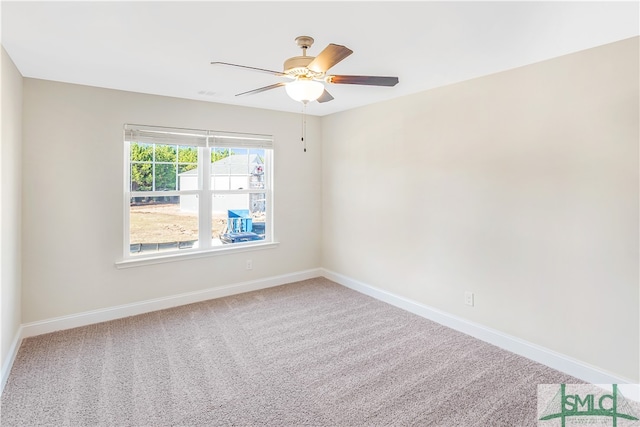 unfurnished room featuring carpet and ceiling fan