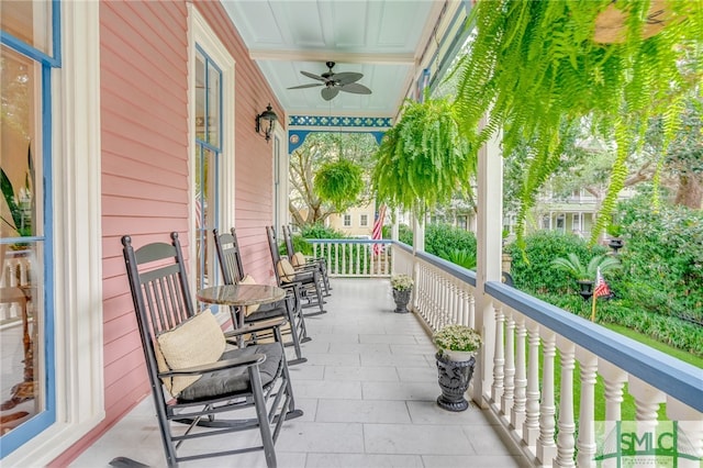 balcony featuring ceiling fan and covered porch