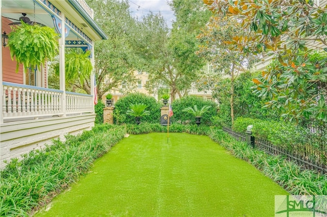 view of yard featuring ceiling fan