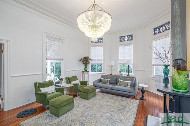 living room with ornamental molding, dark hardwood / wood-style floors, and a healthy amount of sunlight