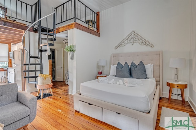 bedroom with hardwood / wood-style floors