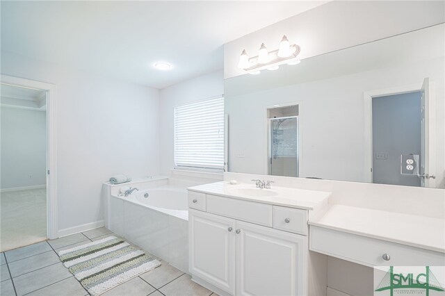 bathroom with plus walk in shower, tile patterned floors, and vanity