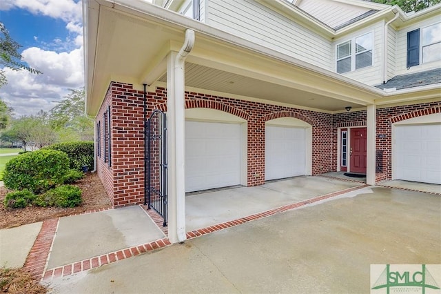 garage featuring concrete driveway