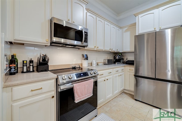 kitchen featuring crown molding, light tile patterned floors, stainless steel appliances, tasteful backsplash, and light countertops