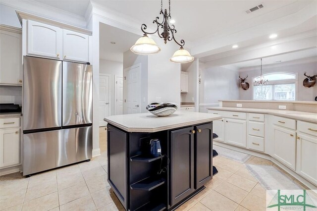 401 River Oaks Dr, Richmond Hill, GA 31324 - kitchen featuring open shelves, stainless steel refrigerator, visible vents, and light tile patterned floors