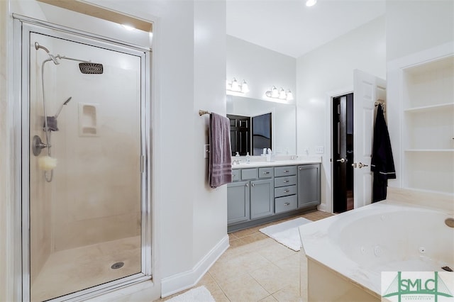 full bath with baseboards, a shower stall, tile patterned floors, a whirlpool tub, and double vanity