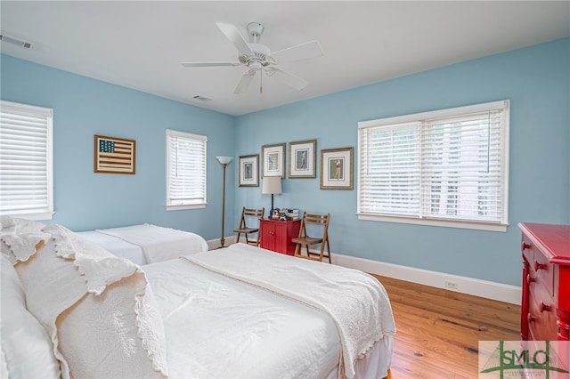 bedroom featuring wood-type flooring and ceiling fan