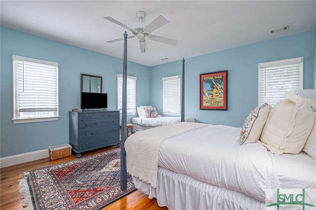 bedroom featuring ceiling fan and light hardwood / wood-style flooring