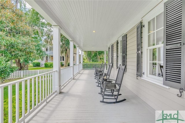 wooden terrace with a porch