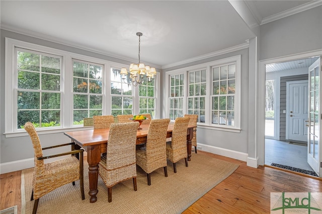 dining space with light wood-type flooring and plenty of natural light