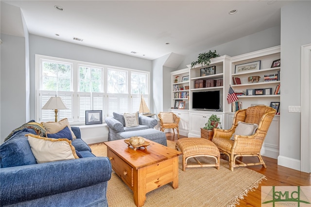 living room with light hardwood / wood-style floors